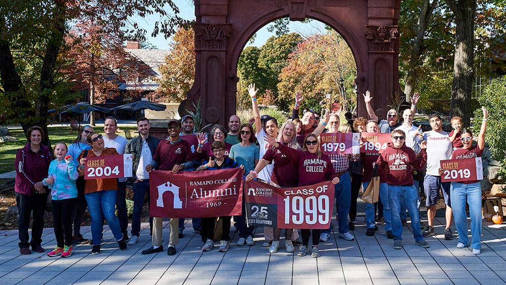 out-and-about_spring2025-home Ramapo Alumni by the arch