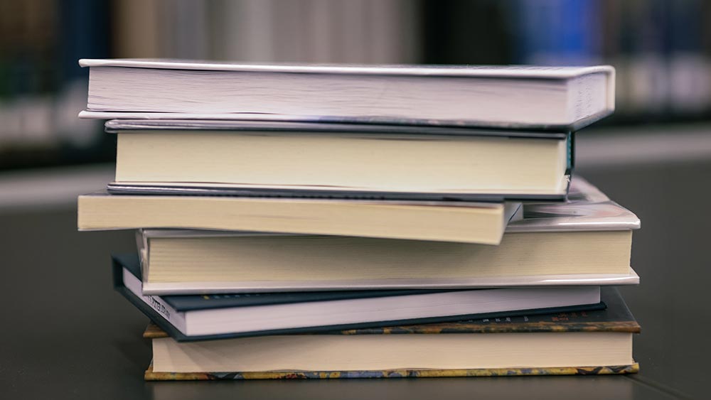 what-we-are-reading_spring2025-home Stack of books